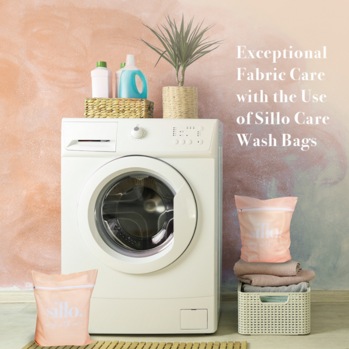 Front-load washing machine with Sillo Care wash bags beside it, showcasing how to wash silk pillowcases safely using gentle detergent, cold water, and protective wash bags for long-lasting fabric care.