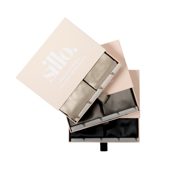 Black, Light Champagne, and Charcoal Grey Sillo silk pillowcase gift set with Sillo Care Washbag — 22 Momme 6A grade organic Mulberry silk pillowcases in recyclable, eco-friendly packaging for luxury self-care, gifting, and anti-aging skin benefits.