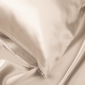 Close-up of Light Champagne Sillo silk pillowcase — 22 Momme 6A grade organic Mulberry silk woven with silver ions for antibacterial protection, showing smooth texture, envelope-style closure, and natural sheen; gentle on skin and hair.