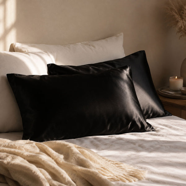 Sillo silk pillowcase 2 pack in black 22 momme mulberry silk in a bedroom setting 