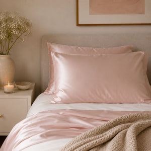 Sillo silk pillowcase 2 pack in blush pink 22 momme mulberry silk in a bedroom setting 