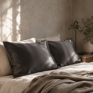 Sillo silk pillowcase 2 pack in charcoal grey  22 momme mulberry silk in a bedroom setting 