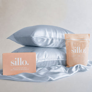 Sillo Haze Blue Silk Pillowcase 2 Pack Gift Set — Anti-Acne, Reduces Hair Frizz and Breakage, 22-Momme Grade 6A Organic Mulberry Silk Woven with Silver Ions, Includes 2 Silk Pillowcases and Sillo Care Washbag
