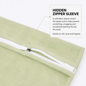 Zipper protective sleeve close up on the Sillo Care pistachio color mesh laundry wash bag, a soft sleeve covering the zipper teeth to keep silk, lace and lingerie snag free during machine washing, unlike standard wash bags that scratch delicate fabrics.