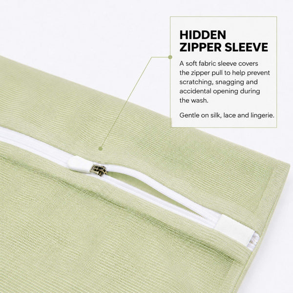 Zipper protective sleeve close up on the Sillo Care pistachio color mesh laundry wash bag, a soft sleeve covering the zipper teeth to keep silk, lace and lingerie snag free during machine washing, unlike standard wash bags that scratch delicate fabrics.