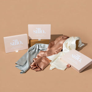 Ivory White, Silver, and Rose Pink  Sillo silk pillowcase gift set with Sillo Care Washbag — 22 Momme 6A grade organic Mulberry silk pillowcases in recyclable, eco-friendly packaging for luxury self-care, gifting, and anti-aging skin benefits.
