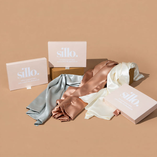 Ivory White, Silver, and Rose Pink  Sillo silk pillowcase gift set with Sillo Care Washbag — 22 Momme 6A grade organic Mulberry silk pillowcases in recyclable, eco-friendly packaging for luxury self-care, gifting, and anti-aging skin benefits.