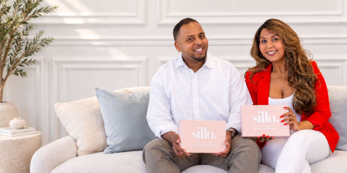 Brother and sister behind Sillo holding the Sillo 22 Momme mulberry silk pillowcase gift set, woven with silver ions and thoughtfully made for sensitive, acne-prone skin, hair care and sleep.