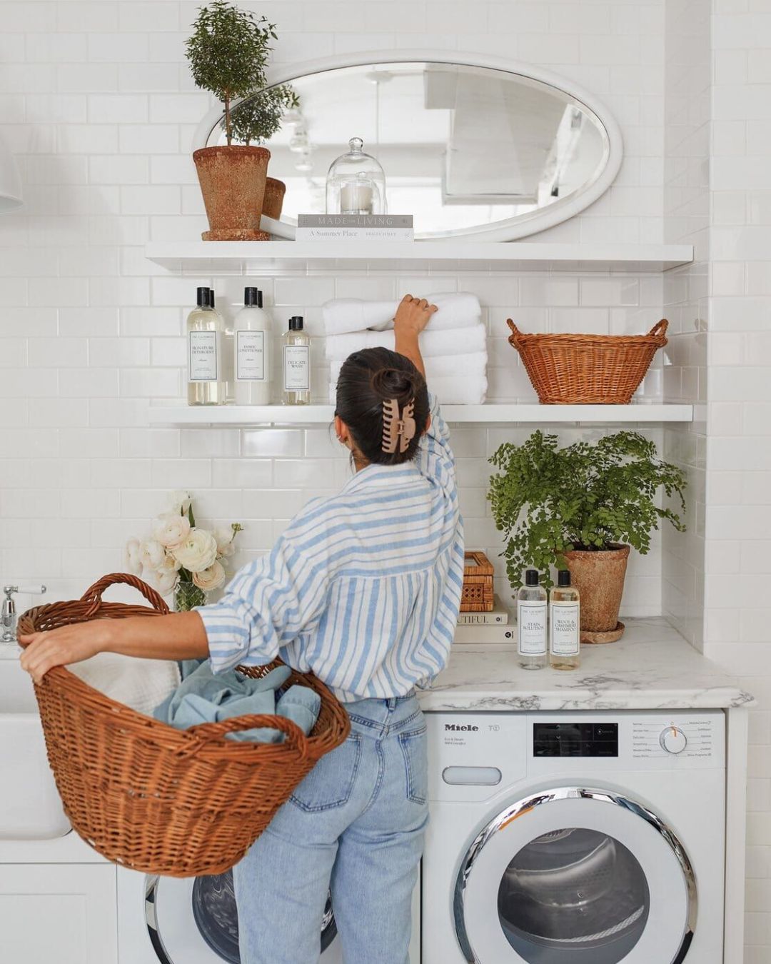 Woman doing laundry with the Sillo Care delicate laundry washbag, protecting her bras and lingerie undergarments  in the wash
