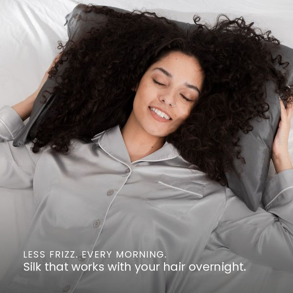 Lifestyle image of woman sleeping on Charcoal Grey Sillo silk pillowcase — smooth, temperature-regulating silk that helps prevent acne, wrinkles, frizz, breakage, while caring for sensitive skin.