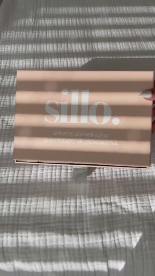 Video showcasing the Sillo silk pillowcase gift set — includes two silver-ion infused, anti-acne 6A-grade 22-Momme mulberry silk pillowcases and a Sillo Care Washbag in recycled packaging; hypoallergenic, sustainable, and designed for clearer skin, smoother hair, and luxurious sleep.