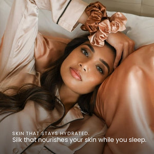 Lifestyle image of woman sleeping on Rose Pink Sillo silk pillowcase — smooth, temperature-regulating silk that helps prevent acne, wrinkles, frizz, breakage, while caring for sensitive skin.