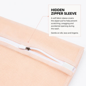 Zipper protective sleeve close up on the Sillo Care mesh laundry wash bag, a soft sleeve covering the zipper teeth to keep silk, lace and lingerie snag free during machine washing, unlike standard wash bags that scratch delicate fabrics.