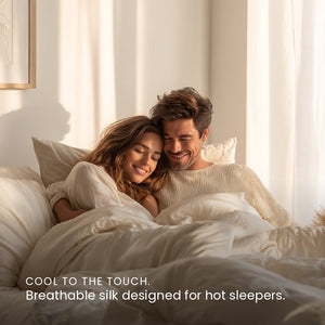 Ivory White Sillo silk pillowcase styled on bed in modern bedroom; 22-Momme Mulberry silk woven with silver ions for acne-prone, sensitive skin and hot sleepers seeking cool, temperature-regulating, wrinkle-reducing sleep.